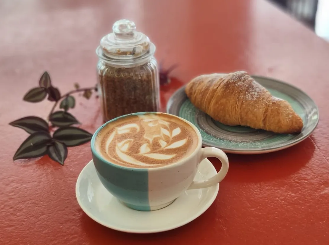 Specialty coffee and freshly baked croissant for digital nomads at Kanvas Cafe Palolem
